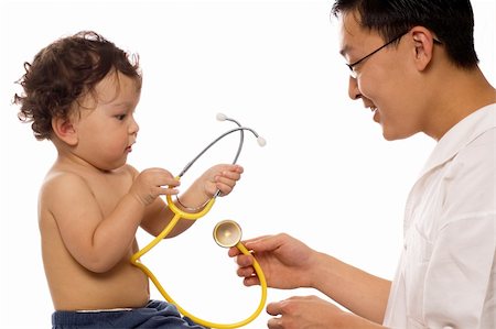 simsearch:400-06416929,k - Playfull baby at the doctor,isolated on a white background. Stock Photo - Budget Royalty-Free & Subscription, Code: 400-04133935