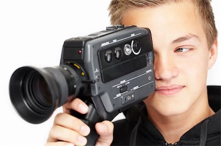 film making - A young photographer with a 8mm camera Stock Photo - Budget Royalty-Free & Subscription, Code: 400-04144541