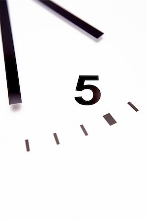 five minutes - Clock face closeup. White background. Stock Photo - Budget Royalty-Free & Subscription, Code: 400-04145167