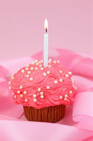 Birthday cake on pink background Stock Photo - Budget Royalty-Free & Subscription, Code: 400-04145235