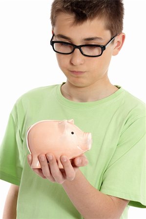 simsearch:400-05248280,k - Boy wearing a green t-shirt ponders over a money box. Foto de stock - Super Valor sin royalties y Suscripción, Código: 400-04146925