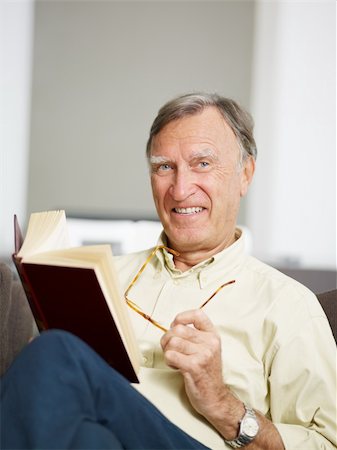 simsearch:400-04026722,k - senior man reading book at home and looking at camera. Copy space Stock Photo - Budget Royalty-Free & Subscription, Code: 400-04146951