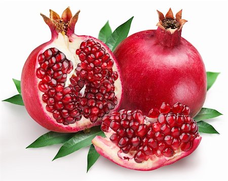 pomegranates on a white background Foto de stock - Royalty-Free Super Valor e Assinatura, Número: 400-04147868