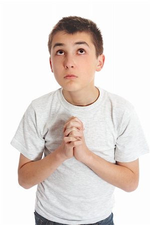 simsearch:400-04178541,k - Boy with hands clasped in prayer looks to heaven God for answers Photographie de stock - Aubaine LD & Abonnement, Code: 400-04149206