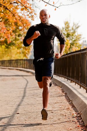 park central - An African American jogging in a park in the morning Foto de stock - Super Valor sin royalties y Suscripción, Código: 400-04149629