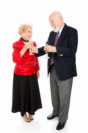 simsearch:400-05234340,k - Senior man at a holiday party handing his beautiful wife a glass of champagne.  Full body isolated on white. Stock Photo - Budget Royalty-Free & Subscription, Code: 400-04149756
