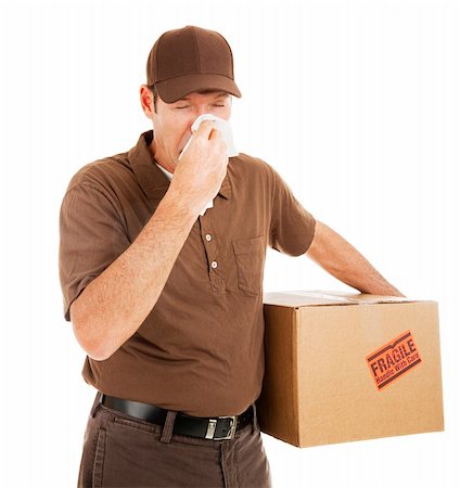 delivery driver hat - Delivery man suffering with a cold or flu on the job.  Isolated on white. Stock Photo - Budget Royalty-Free & Subscription, Code: 400-04149769