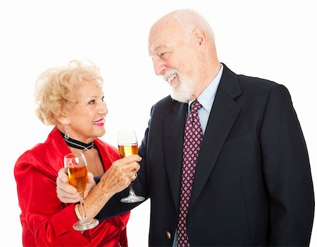 simsearch:400-05234340,k - Happy senior couple making a toast with champagne.  Isolated on white. Stock Photo - Budget Royalty-Free & Subscription, Code: 400-04149816