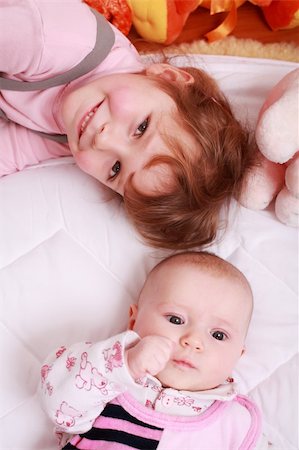 simsearch:400-04161658,k - Cute older sister with small baby and toys Fotografie stock - Microstock e Abbonamento, Codice: 400-04140554