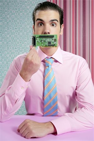 Businessman with electronic circuit in face as technology metaphor Stock Photo - Budget Royalty-Free & Subscription, Code: 400-04140616