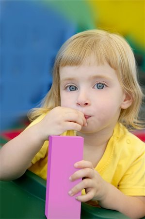 Beautiful blond girl drinking pink juice with strobe Stock Photo - Budget Royalty-Free & Subscription, Code: 400-04140673
