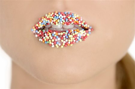 close up of woman lips with multicolored sweet pearls Stock Photo - Budget Royalty-Free & Subscription, Code: 400-04140685