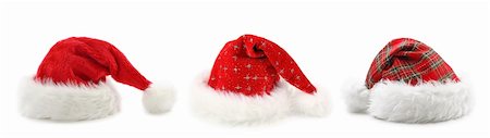 simsearch:400-05301621,k - Santa Claus hats isolated on white background Foto de stock - Super Valor sin royalties y Suscripción, Código: 400-04141216