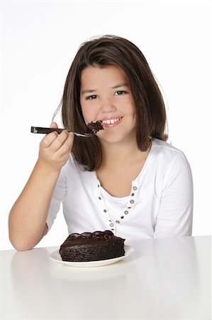 simsearch:400-04637126,k - Cute Caucasian child eating a slice of chocolate cake Foto de stock - Royalty-Free Super Valor e Assinatura, Número: 400-04141329