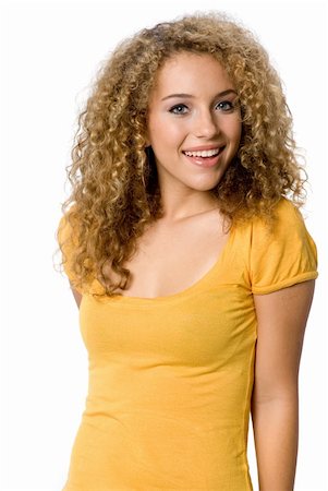 eastwestimaging (artist) - A happy teenage girl with curly hair on white background Foto de stock - Super Valor sin royalties y Suscripción, Código: 400-04142820