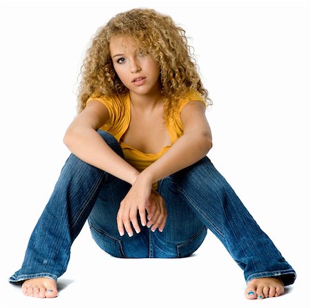 eastwestimaging (artist) - A pretty teenage girl in yellow top and jeans on white background Fotografie stock - Microstock e Abbonamento, Codice: 400-04142861