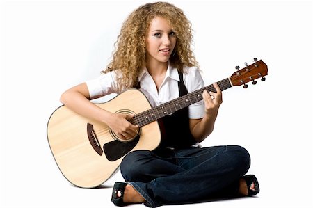 eastwestimaging (artist) - A pretty young woman playing acoustic guitar on white background Fotografie stock - Microstock e Abbonamento, Codice: 400-04143006