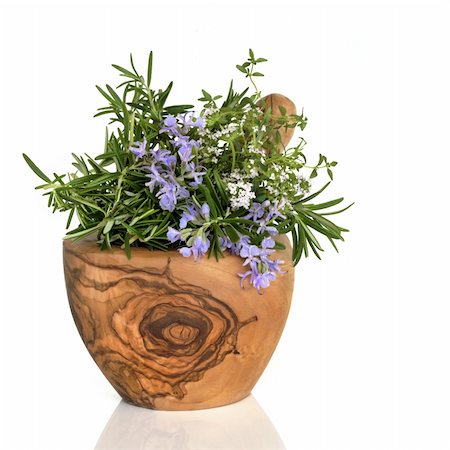 simsearch:400-06521200,k - Rosemary and thyme herbs in flower in an olive wood mortar with pestle, over white background. Fotografie stock - Microstock e Abbonamento, Codice: 400-04143515