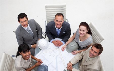 High angle of architects working with plans in an office Stock Photo - Budget Royalty-Free & Subscription, Code: 400-04154690