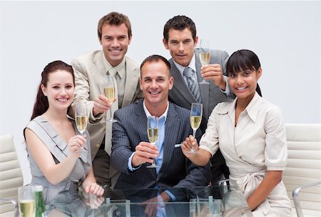 simsearch:400-04187718,k - Happy business team celebrating a success with champagne in the office Foto de stock - Royalty-Free Super Valor e Assinatura, Número: 400-04154704