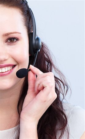 simsearch:400-03990860,k - Portrait of smiling attractive woman talking on a headset Photographie de stock - Aubaine LD & Abonnement, Code: 400-04154725