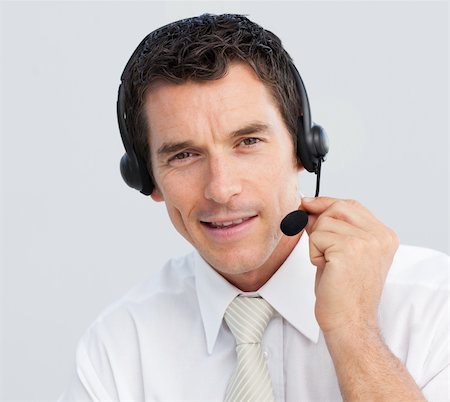 simsearch:400-03990860,k - Portrait of an attractive smiling businessman working in a call center Photographie de stock - Aubaine LD & Abonnement, Code: 400-04154735