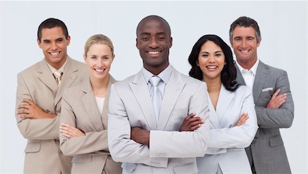 Smiling African businessman leading his team against white background Stock Photo - Budget Royalty-Free & Subscription, Code: 400-04154760