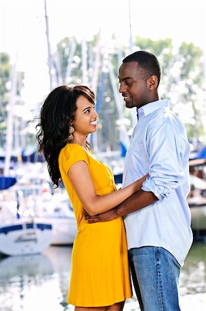 Young romantic couple facing each other hugging and standing at harbor Stock Photo - Budget Royalty-Free & Subscription, Code: 400-04155045