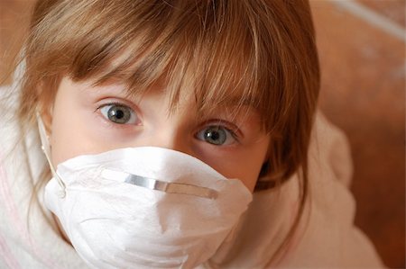 close-up portrait of a little girl wearing a protective mask Stock Photo - Budget Royalty-Free & Subscription, Code: 400-04155129