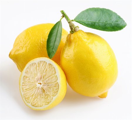 Lemon with section on a white background Foto de stock - Royalty-Free Super Valor e Assinatura, Número: 400-04155264