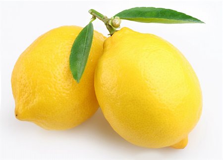 Lemon with leaves on a white background Foto de stock - Royalty-Free Super Valor e Assinatura, Número: 400-04155477