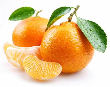 Tangerine with segments on a white background Foto de stock - Royalty-Free Super Valor e Assinatura, Número: 400-04155480