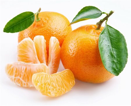 Tangerine with segments on a white background Foto de stock - Royalty-Free Super Valor e Assinatura, Número: 400-04155481