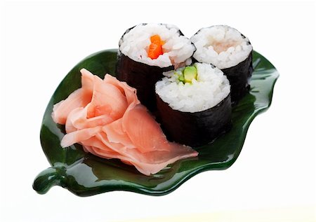 simsearch:400-08070549,k - Three kinds of sushi with ginger on a leaf shaped plate.  Shot on white background. Stockbilder - Microstock & Abonnement, Bildnummer: 400-04155608
