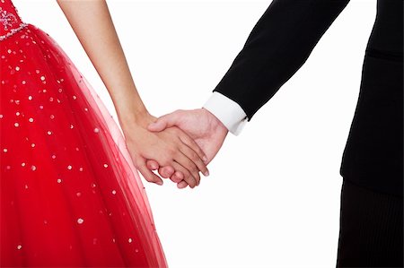 picture of a boy and girl holding hands in date - Boy & girl, in formal attire, holding hands against a white background. Foto de stock - Super Valor sin royalties y Suscripción, Código: 400-04155610