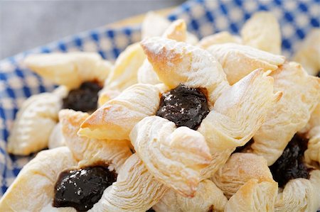 finland food - Finnish star-shaped joulutorttu christmas puff pastrieswith dried plum marmalade Stock Photo - Budget Royalty-Free & Subscription, Code: 400-04155918