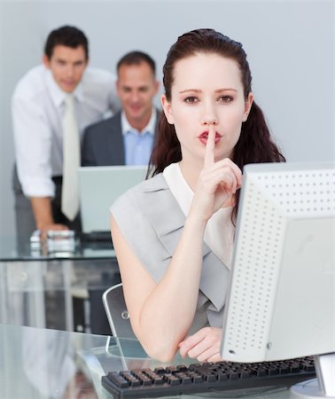 shushing girl - Beautiful businesswoman asking for silence in the office Stock Photo - Budget Royalty-Free & Subscription, Code: 400-04156383