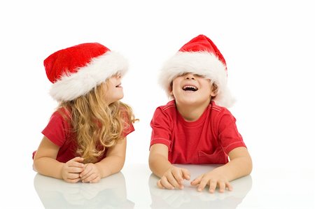 simsearch:400-04114221,k - Kids laughing and having fun with christmas hats - isolated Stock Photo - Budget Royalty-Free & Subscription, Code: 400-04156545