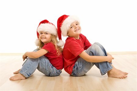 simsearch:400-04114221,k - Happy laughing christmas kids sitting on the floor - isolated Stock Photo - Budget Royalty-Free & Subscription, Code: 400-04156549