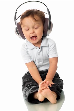 simsearch:400-04196952,k - Sing baby with headphone,isolated on a white background. Foto de stock - Royalty-Free Super Valor e Assinatura, Número: 400-04156570