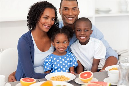 drinks on table coffee juice - Happy Afro-american family having healthy breakfast at home Stock Photo - Budget Royalty-Free & Subscription, Code: 400-04156705