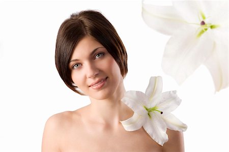 beauty portrait of pretty young woman with a big white lily on her shoulder Stock Photo - Budget Royalty-Free & Subscription, Code: 400-04156738