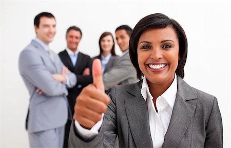 simsearch:400-06567931,k - Attractive female executive smiling at the camera with thumb up. Succes concept. Stock Photo - Budget Royalty-Free & Subscription, Code: 400-04157250