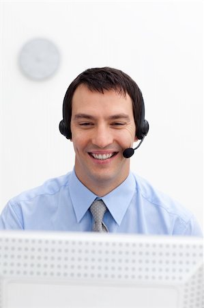 simsearch:400-04129170,k - Young customer service agent with headset on in a call center Fotografie stock - Microstock e Abbonamento, Codice: 400-04157291