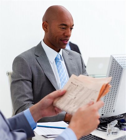 Portrait of an ethnic businessman working at a computer in the office Stock Photo - Budget Royalty-Free & Subscription, Code: 400-04157416