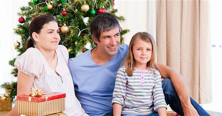 Happy family having fun with Christmas presents Stock Photo - Budget Royalty-Free & Subscription, Code: 400-04157461