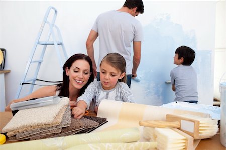 simsearch:400-04349276,k - Happy family painting wall together Stock Photo - Budget Royalty-Free & Subscription, Code: 400-04157497