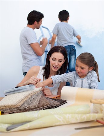 simsearch:400-04349276,k - Happy family painting wall together Stock Photo - Budget Royalty-Free & Subscription, Code: 400-04157501