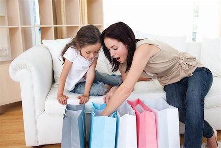 simsearch:400-04323202,k - Mother and daughter unpacking shopping bags in the living-room Stock Photo - Budget Royalty-Free & Subscription, Code: 400-04157549
