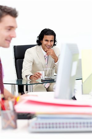 simsearch:400-05282436,k - Two smiling businessmen working in the office. Business concept. Fotografie stock - Microstock e Abbonamento, Codice: 400-04157694